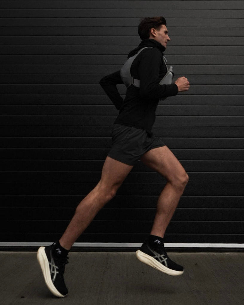 Man running using arcticfit black short crew socks