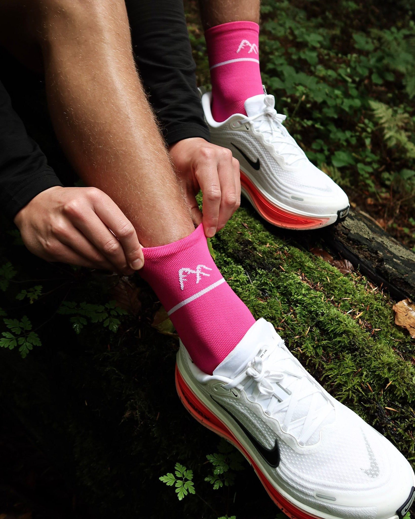 Pink running sock adjustment