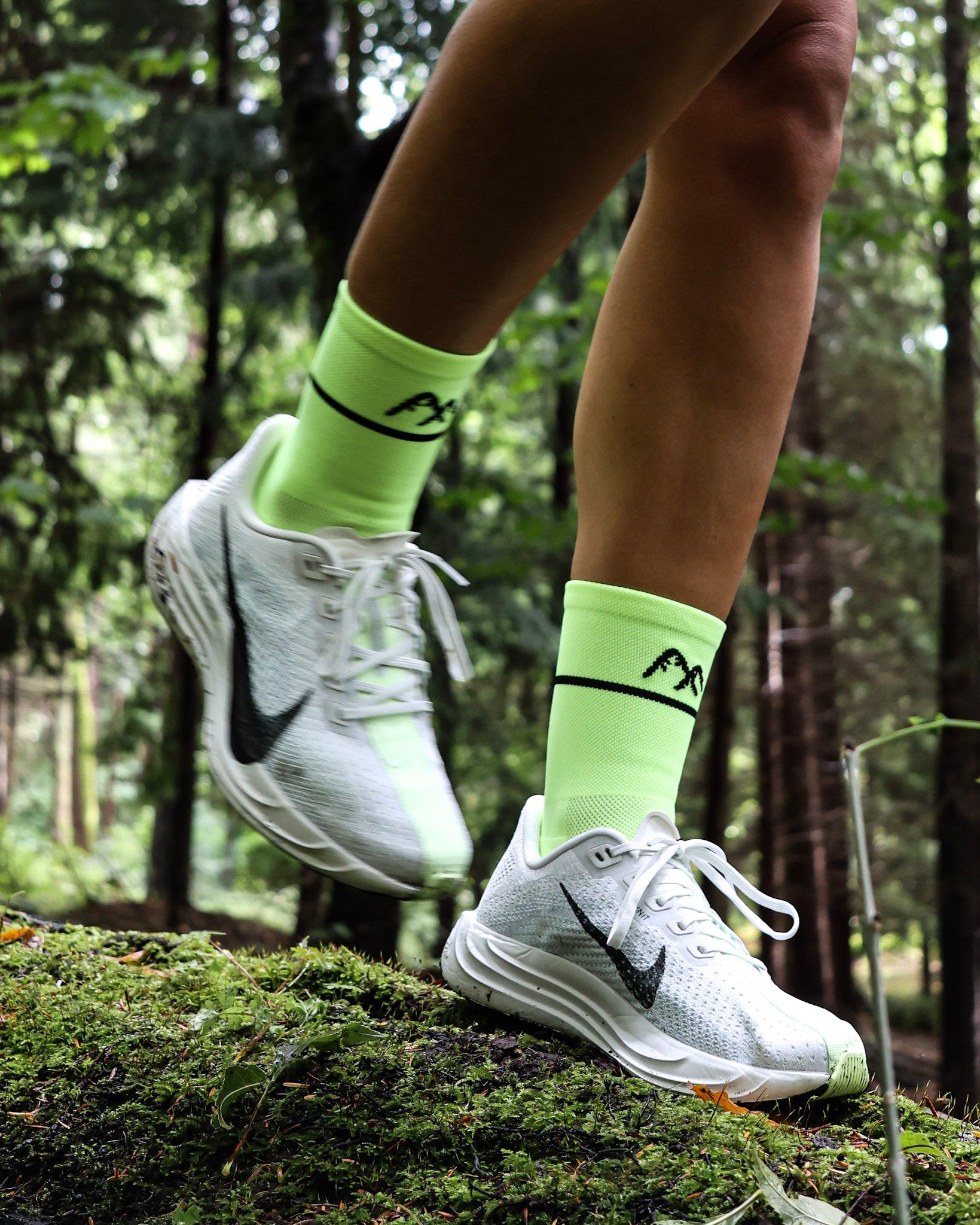 yellow running socks running in woodland